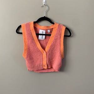 Cropped sweater tank with button detailing.